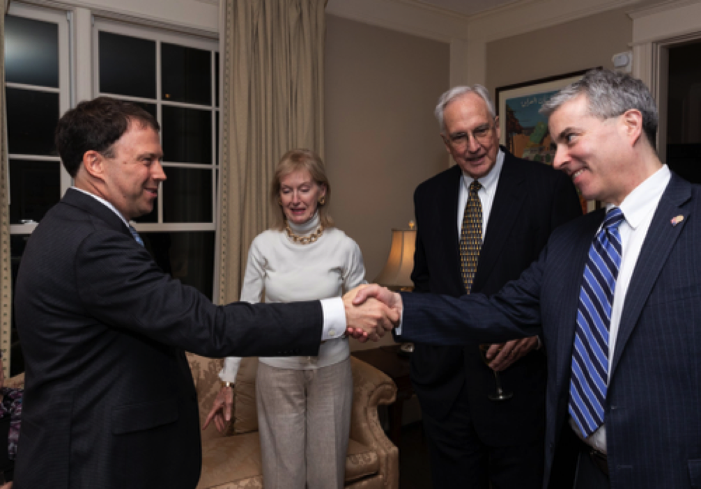 Andrew Marble greets AUSA editor Joe Craig, as former congressman Bob Livingston and wife Bonnie look on.